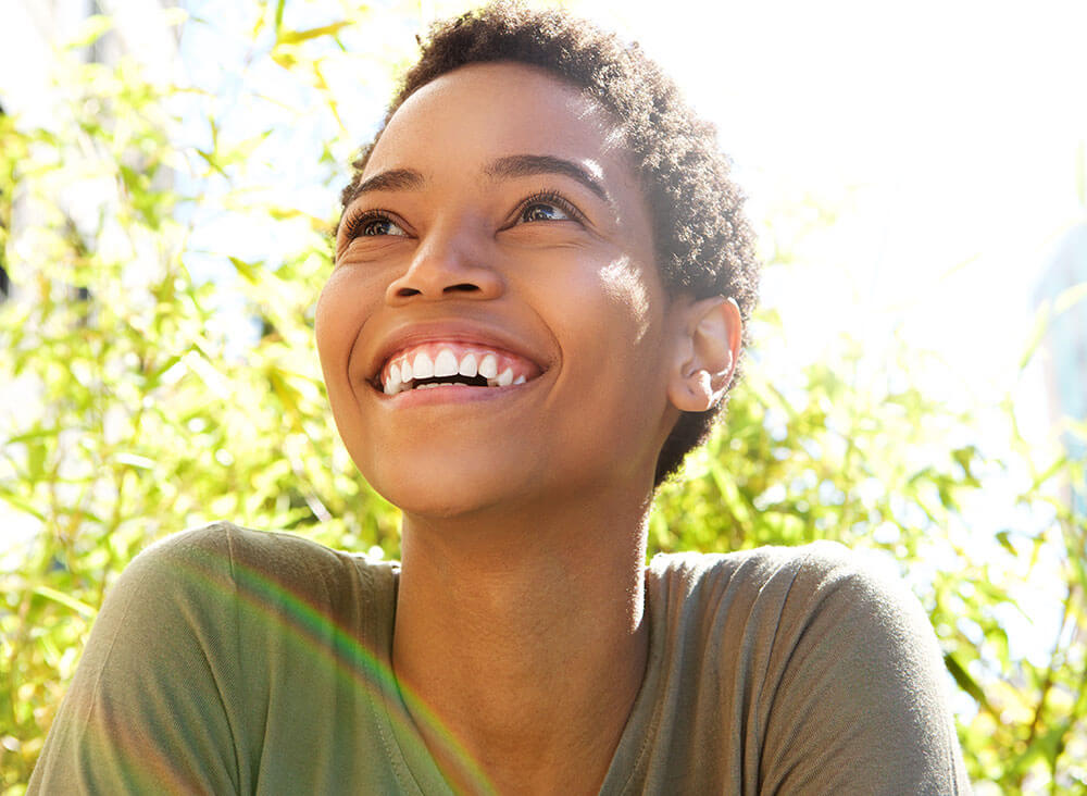 Young woman outside smiling