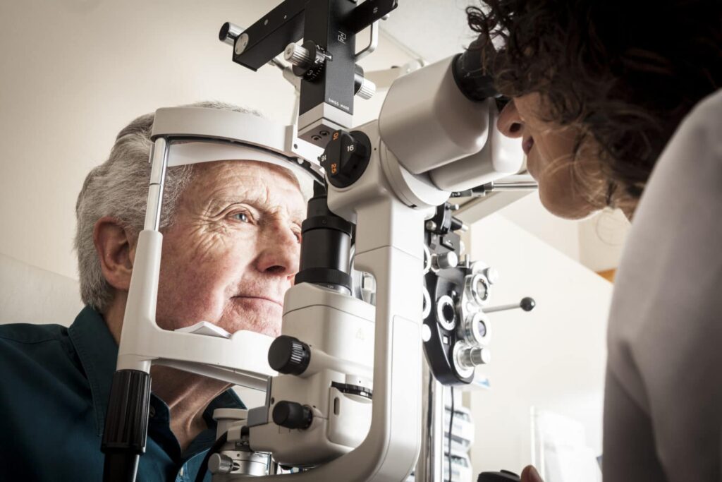 Man getting an eye exam from a doctor