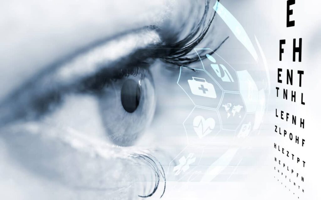 Closeup of eye with illustrated futuristic icons and an eye chart