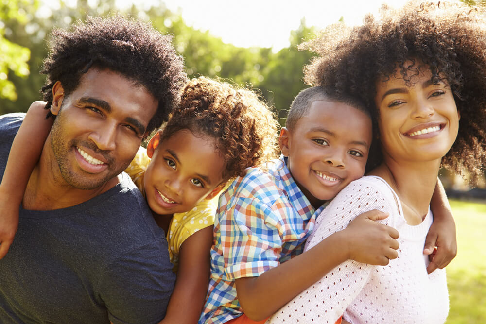 Smiling family outdoors