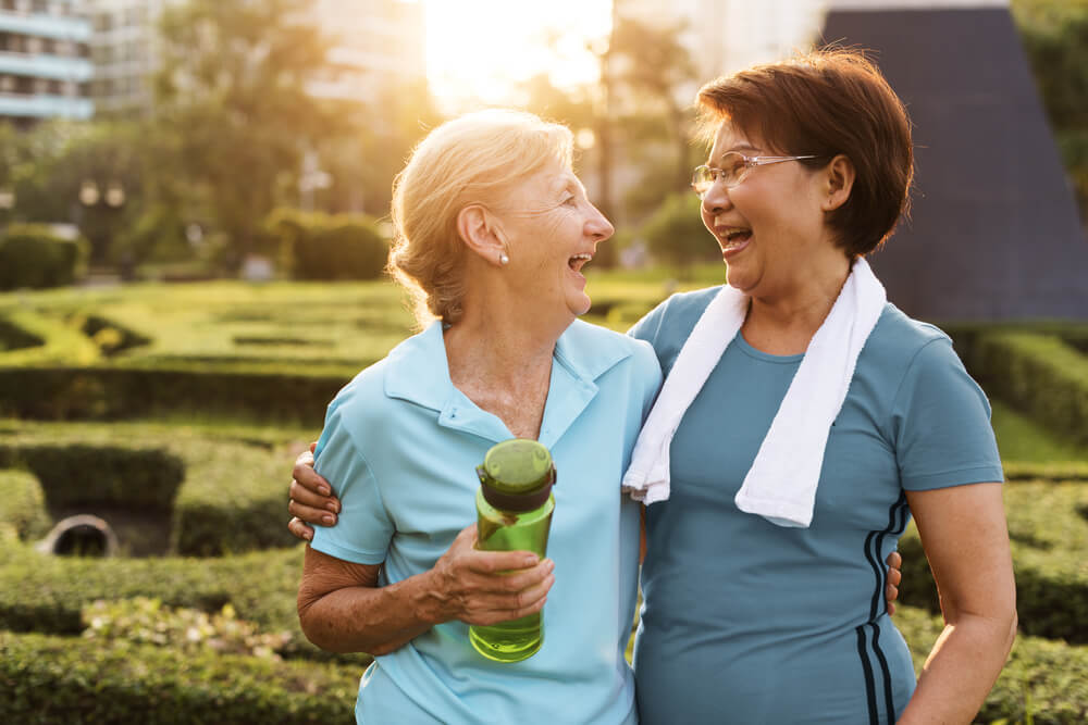 Two older woman outdoors post-workout